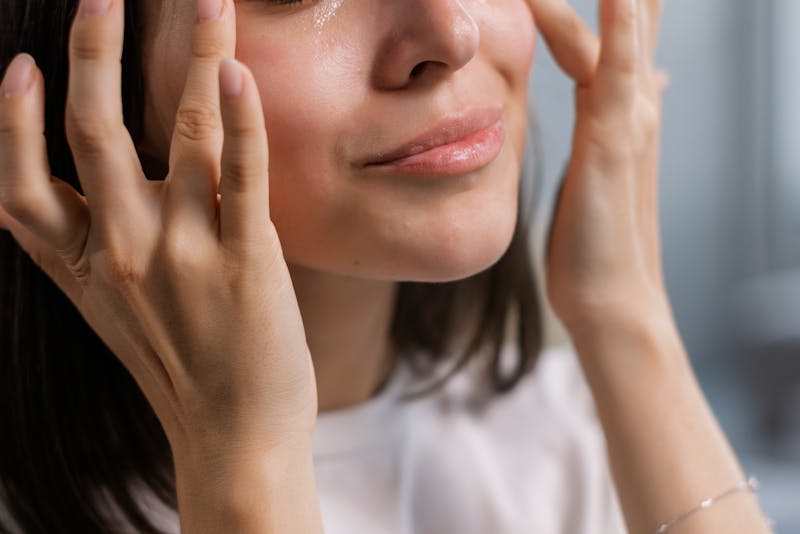 applying oil to face